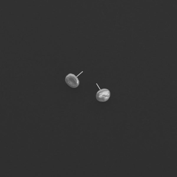 Pearl stud earrings handmade in London with freshwater keshi pearls and 14k gold or sterling silver.