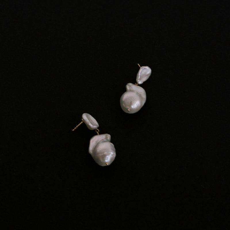 Handmade in the UK, natural freshwater baroque and keshi pearl drop earrings with 9k gold flat lay.